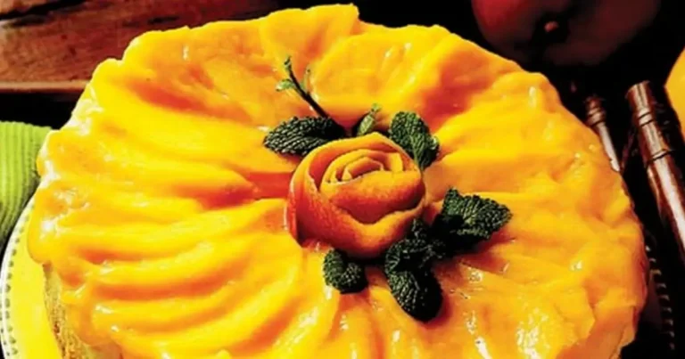Foto da receita de Cheesecake com calda de manga