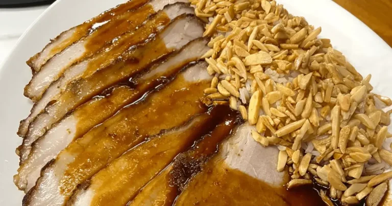 Foto da receita de Pernil assado e arroz com amêndoas